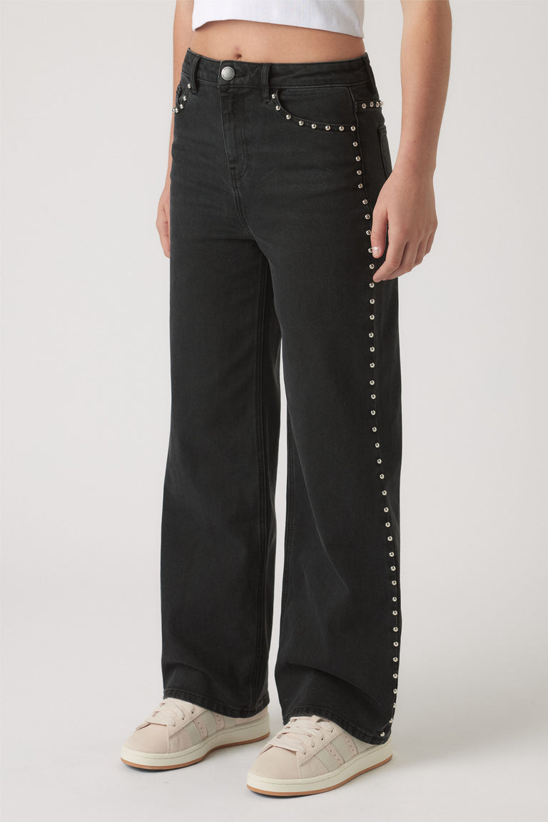 Girls Hailey Studded Jean in black denim with silver stud accents along pockets and leg seams by DECJUBA Australian fashion brand