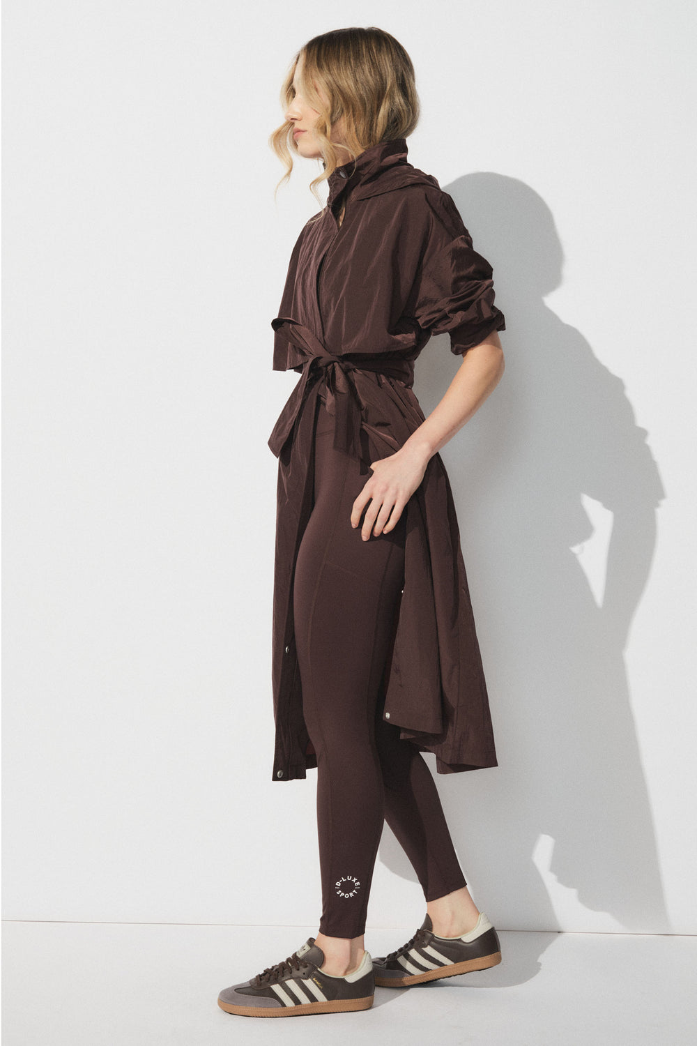 Slim fit D-Luxe Stamp Legging with ankle logo, worn by model in portrait, styled with long belted jacket, gallery 1 image