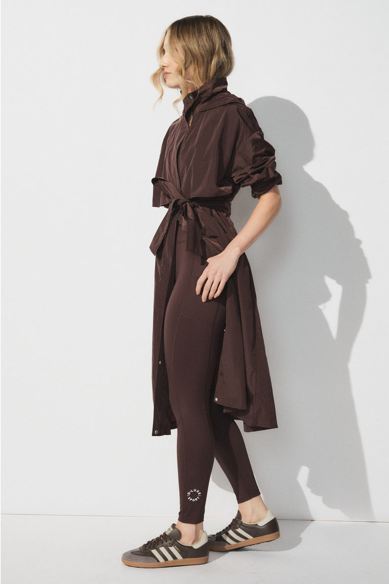 Slim fit D-Luxe Stamp Legging with ankle logo, worn by model in portrait, styled with long belted jacket, gallery 1 image