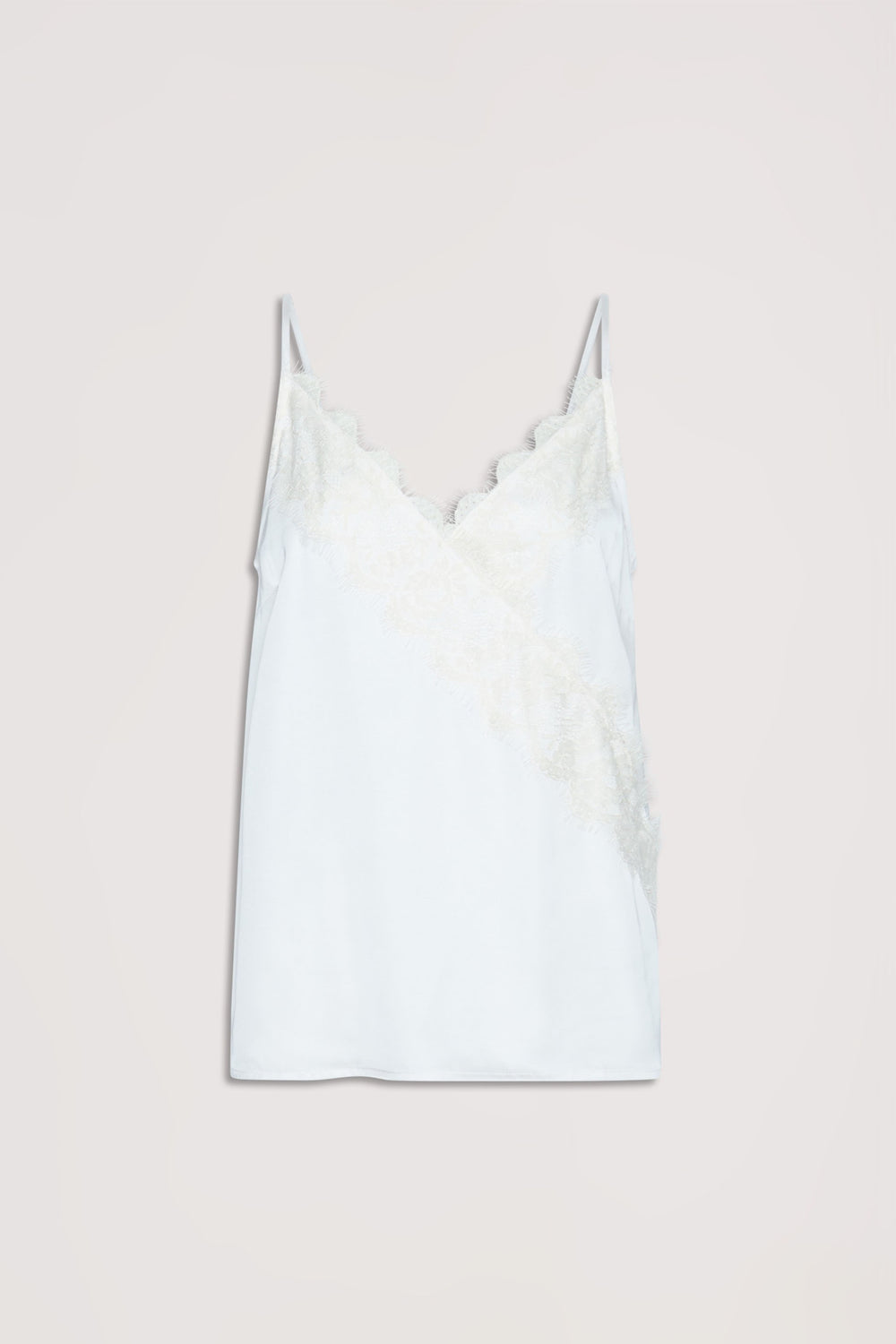 White cami top with delicate lace trim along the neckline and diagonal front, featuring thin straps.