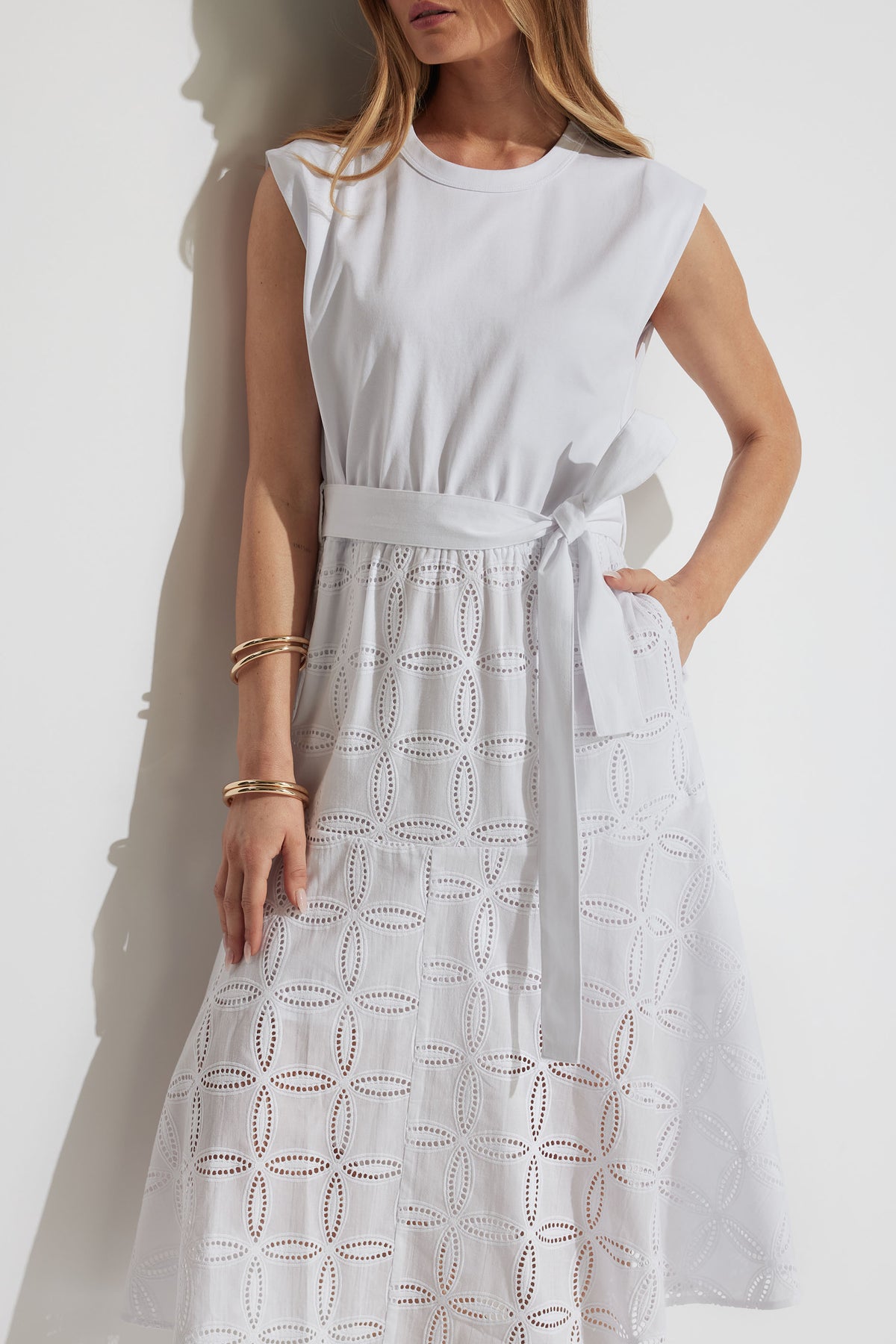 Eden Broderie Midi Dress gallery 2 shows sleeveless round neck with adjustable waist tie and broderie lace skirt.