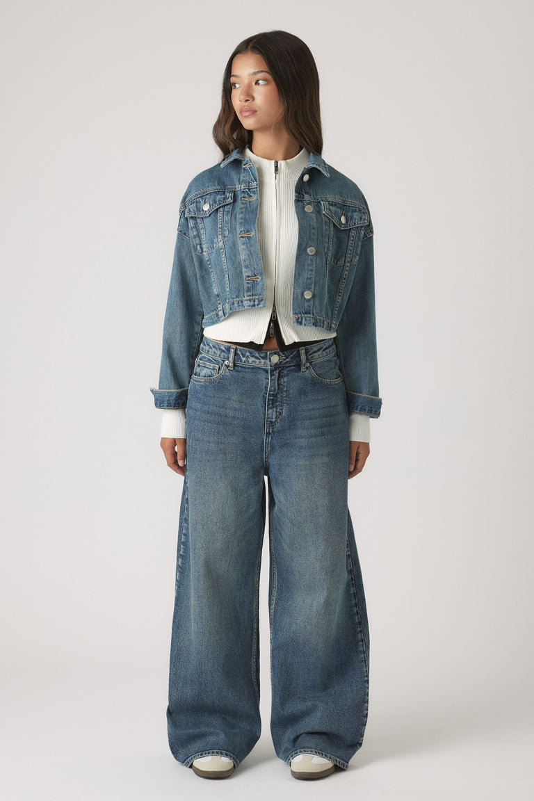 Girls Dad Baggy Jean in loose fit with classic mid-blue denim styled with cropped jacket by DECJUBA Australian fashion brand