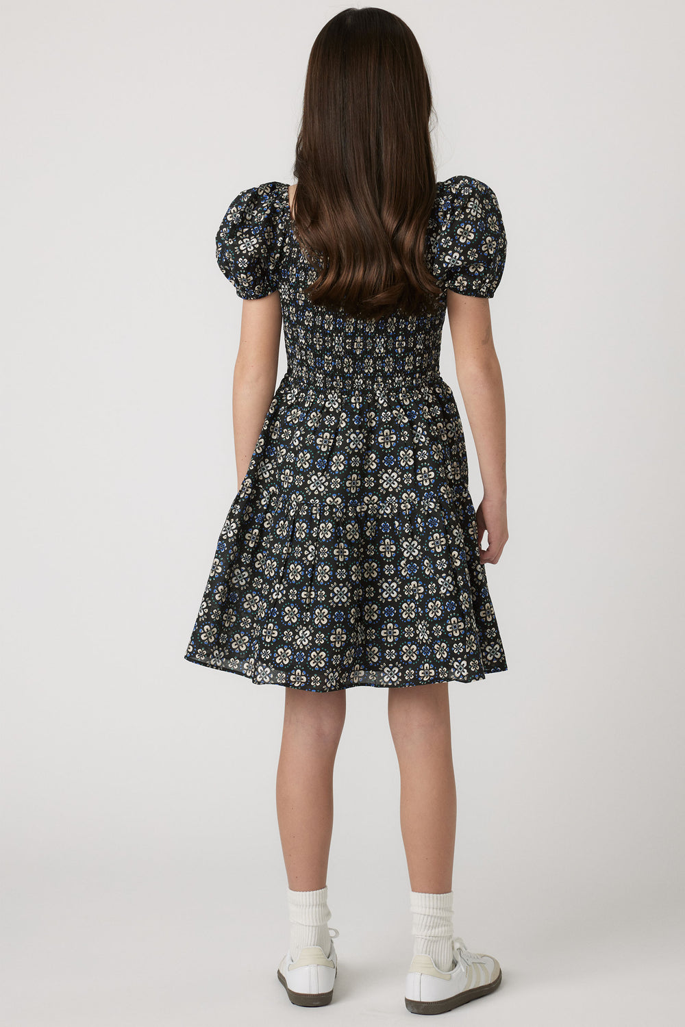 Girls Maude Mini Dress back view with short balloon sleeves and flowy skirt in a floral print, gallery position 2 portrait