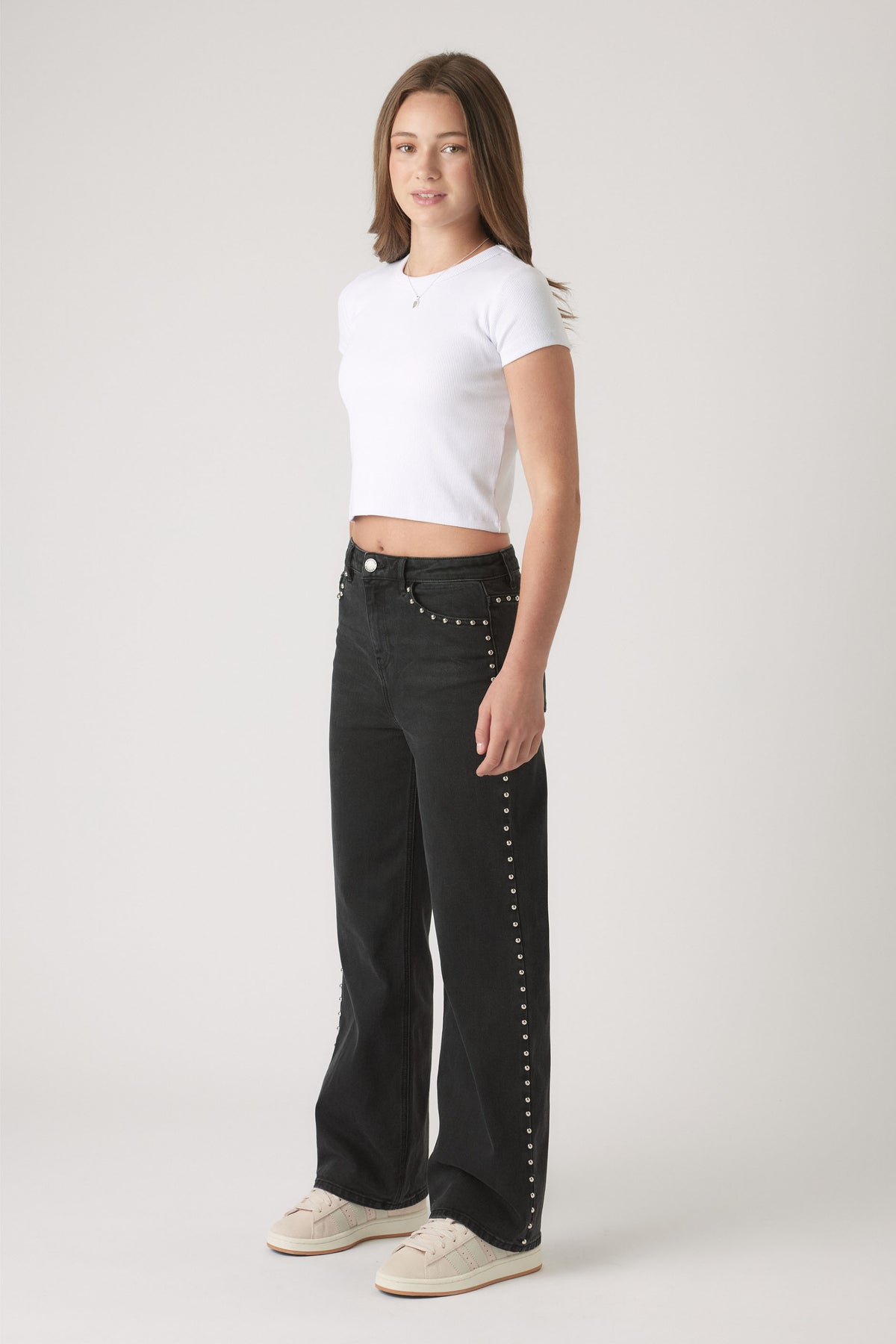 Girls Hailey Studded Jean in black denim featuring silver stud accents along side seams and pockets by DECJUBA Australian fashion brand