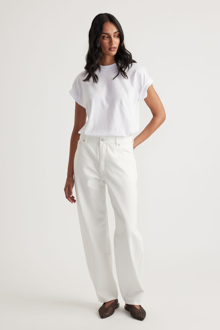 Woman wearing white Chloe Crew Tee with rolled cuffs and relaxed fit in portrait gallery position 1