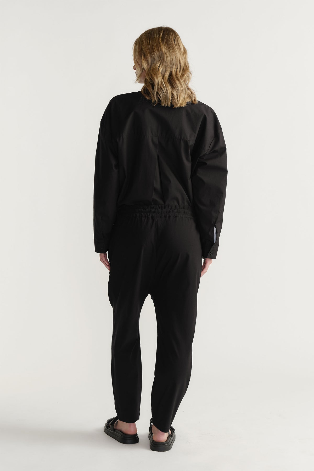 Rear view of woman wearing D-Luxe Button Up Shirt in 100% cotton, styled effortlessly by DECJUBA Australian fashion brand