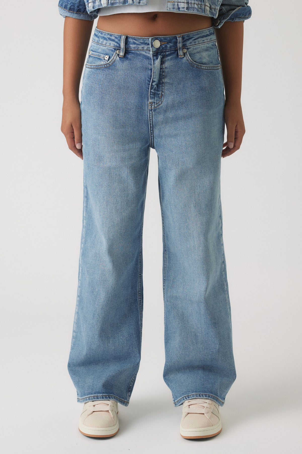 Front view of Girls Hailey Wide Leg Jean in light blue denim with high waist and relaxed fit by Decjuba Australian brand