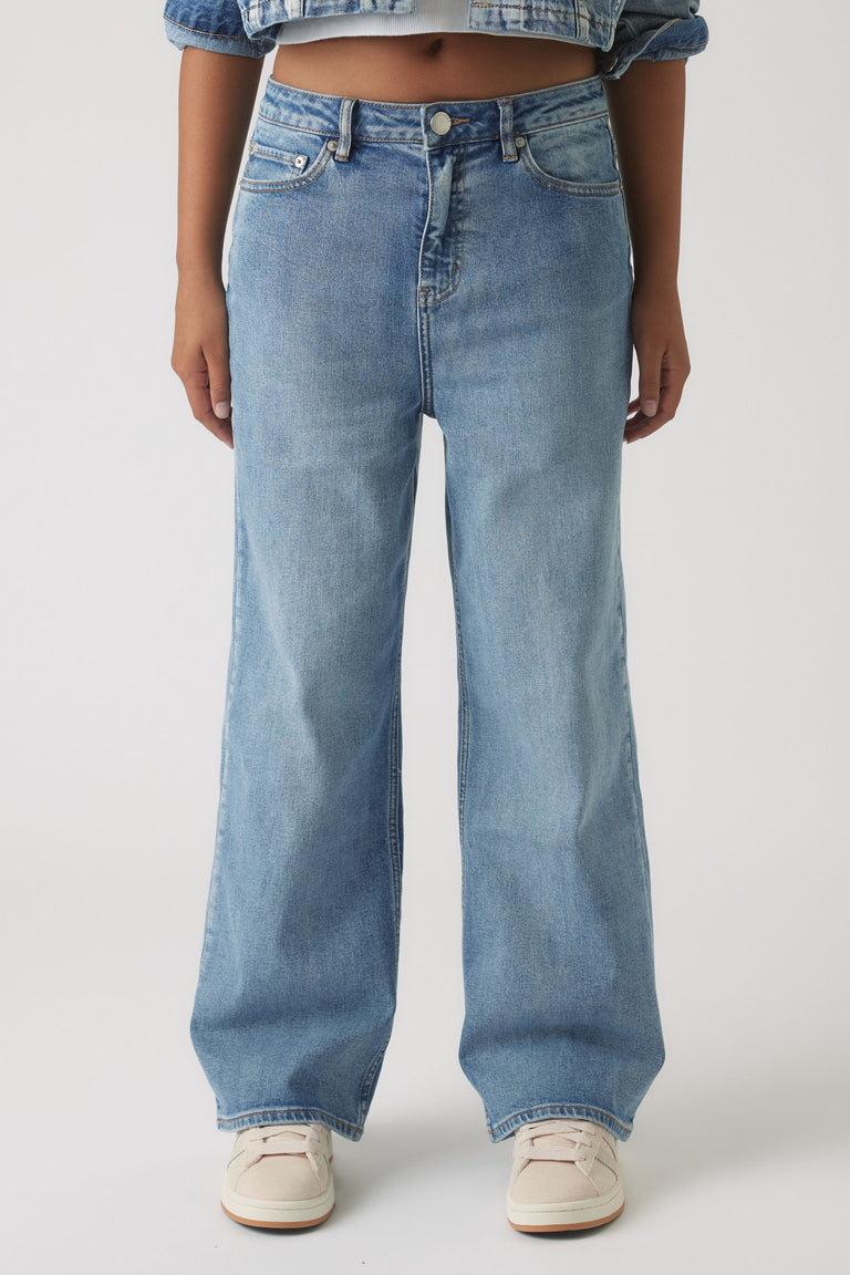 Front view of Girls Hailey Wide Leg Jean in light blue denim with high waist and relaxed fit by Decjuba Australian brand