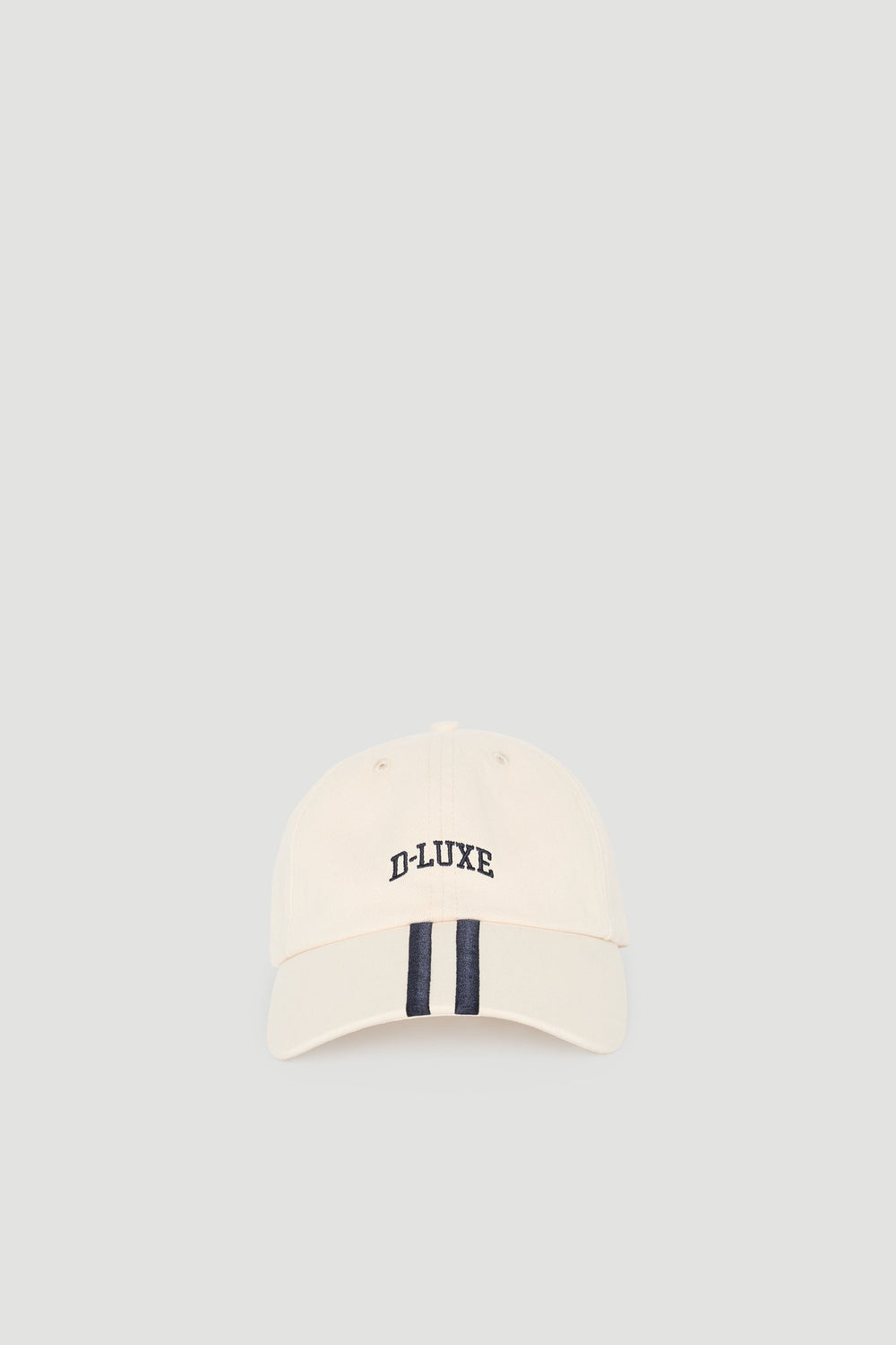 Cream-colored casual cap with navy stripe detail and embroidered D-Luxe logo for a timeless sporty look