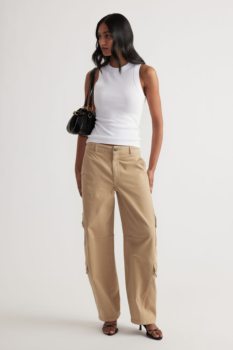 Charlotte Rib Tank in white ribbed knit showcased with beige wide-leg pants and black accessories, styled by DECJUBA Australian brand