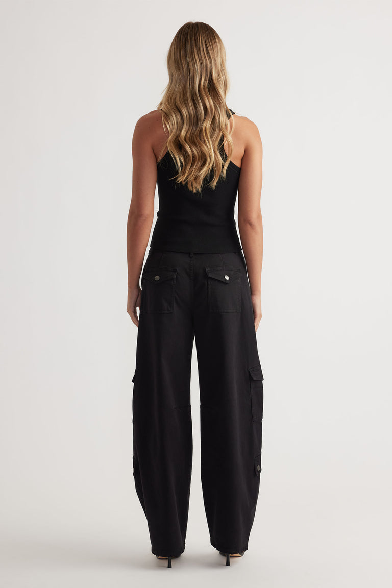 Ava Crew Neck Knit Tank in black with slim fit and sleeveless design, styled with relaxed black cargo pants by DECJUBA Australian brand