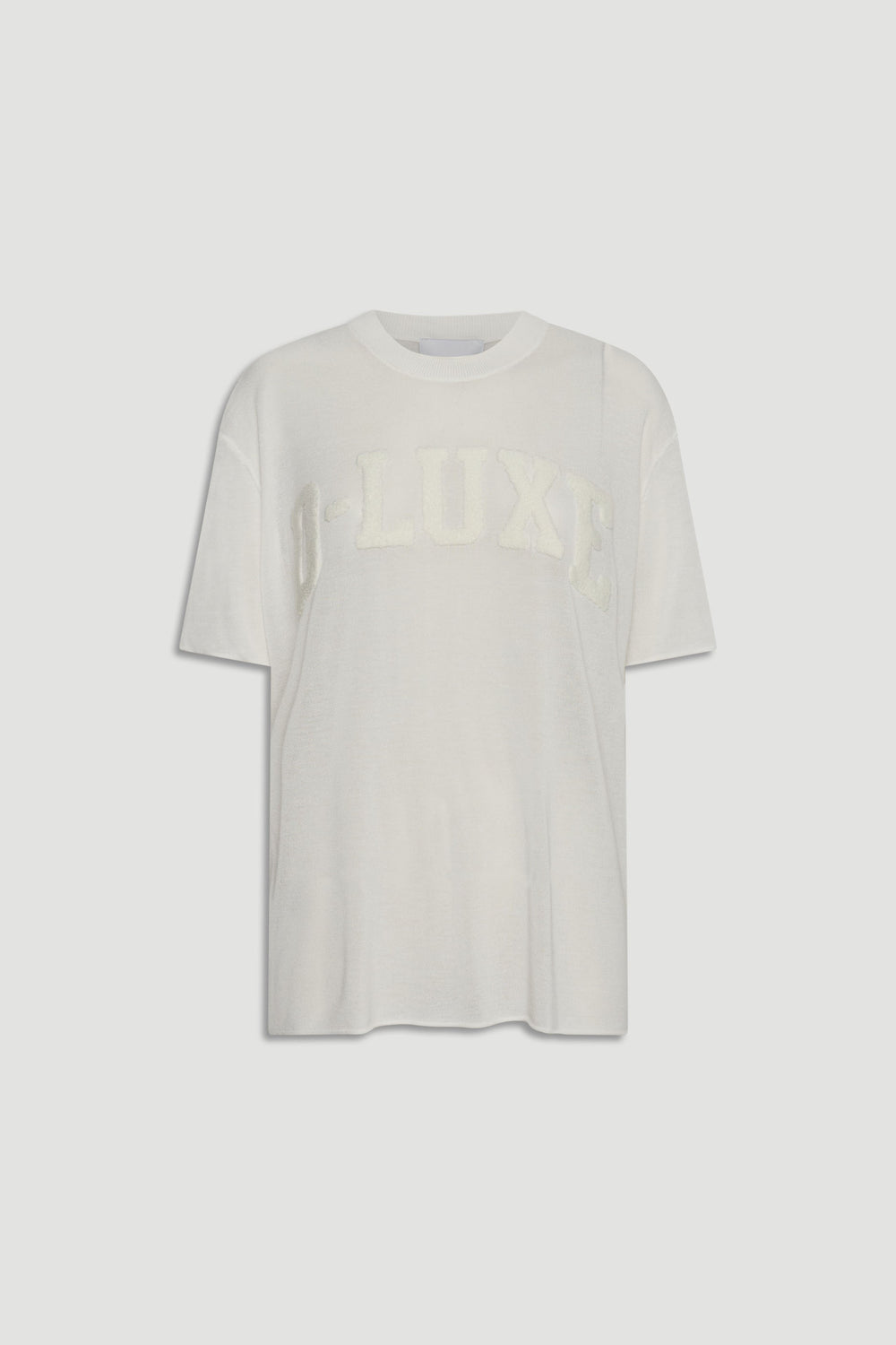 D-Luxe Fine Knit Tee in portrait, gallery position 4, white semi-sheer knitwear with boucle D-LUXE text across chest.
