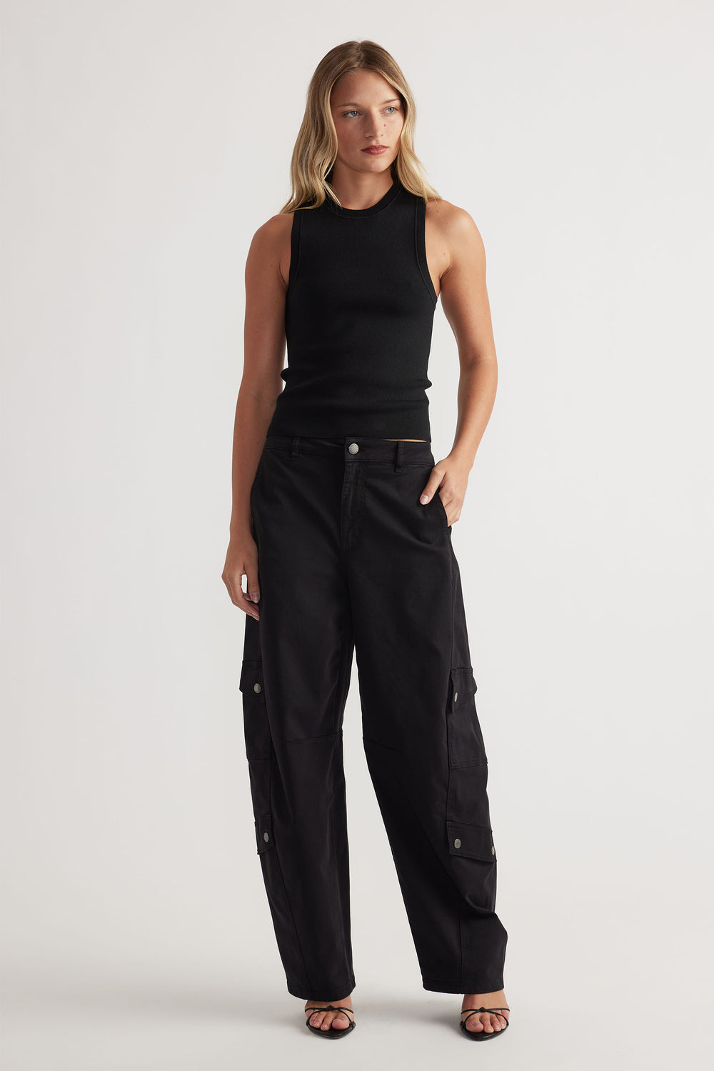 Ava Crew Neck Knit Tank in black ribbed knit with sleek sleeveless cut paired with relaxed black cargo pants by DECJUBA Australian brand