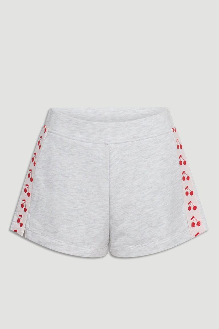 Light grey girls sweat shorts with cherry print panels along the sides for a playful, casual look.