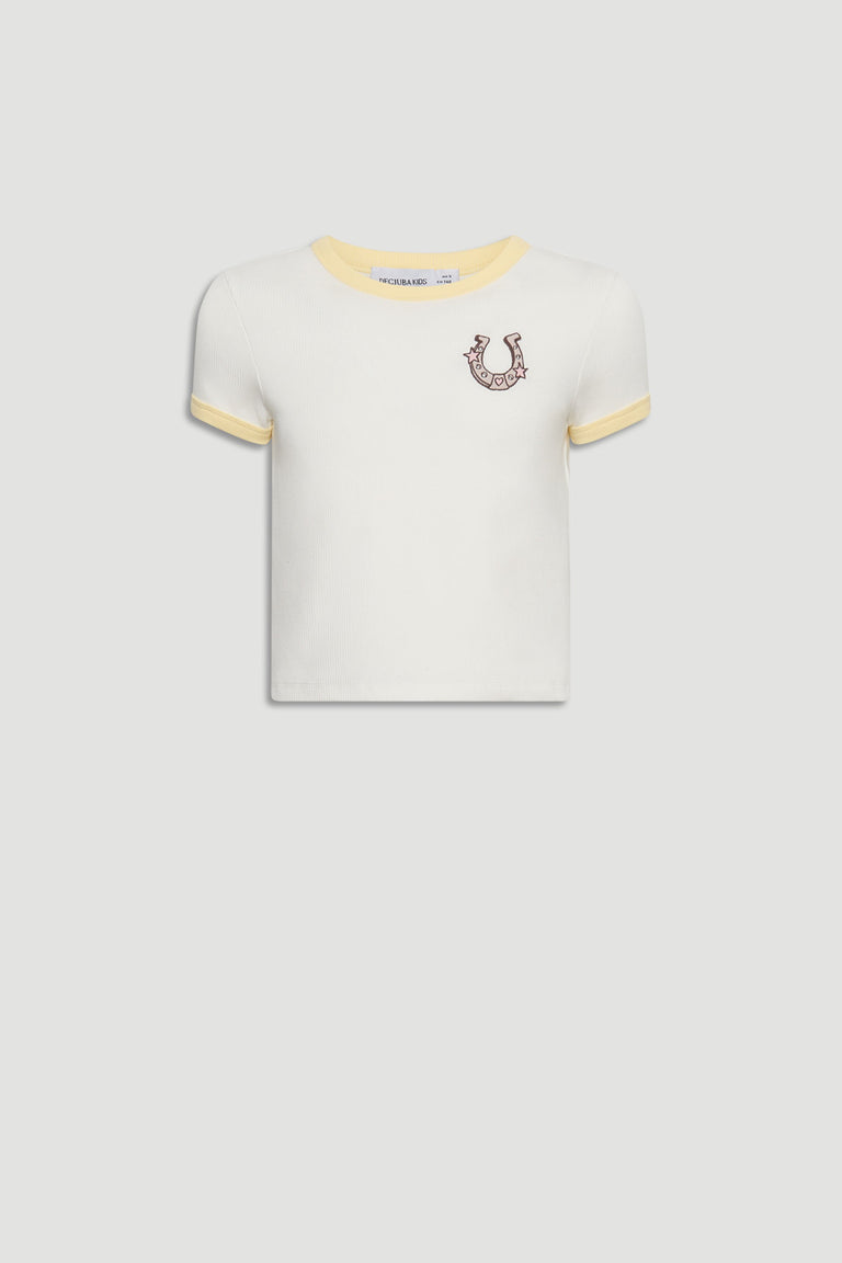 White cropped tee for girls with soft yellow trim and a playful embroidered horseshoe detail on chest