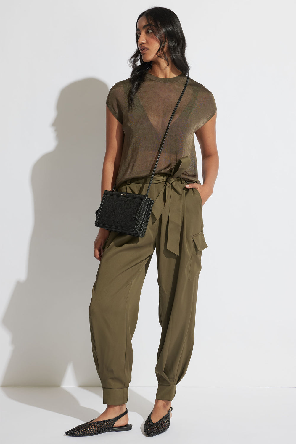Portrait of model wearing relaxed fit Tatum Knit Tee with short sleeves and crew neck in gallery position 1