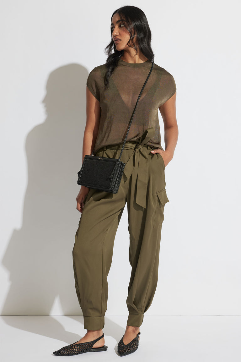 Portrait of model wearing relaxed fit Tatum Knit Tee with short sleeves and crew neck in gallery position 1