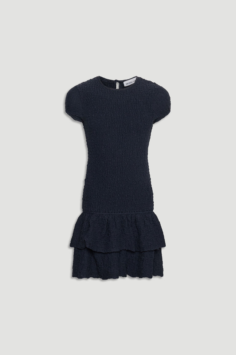 Navy blue shirred girls dress with short sleeves and layered ruffle hem, perfect for casual and special occasions.