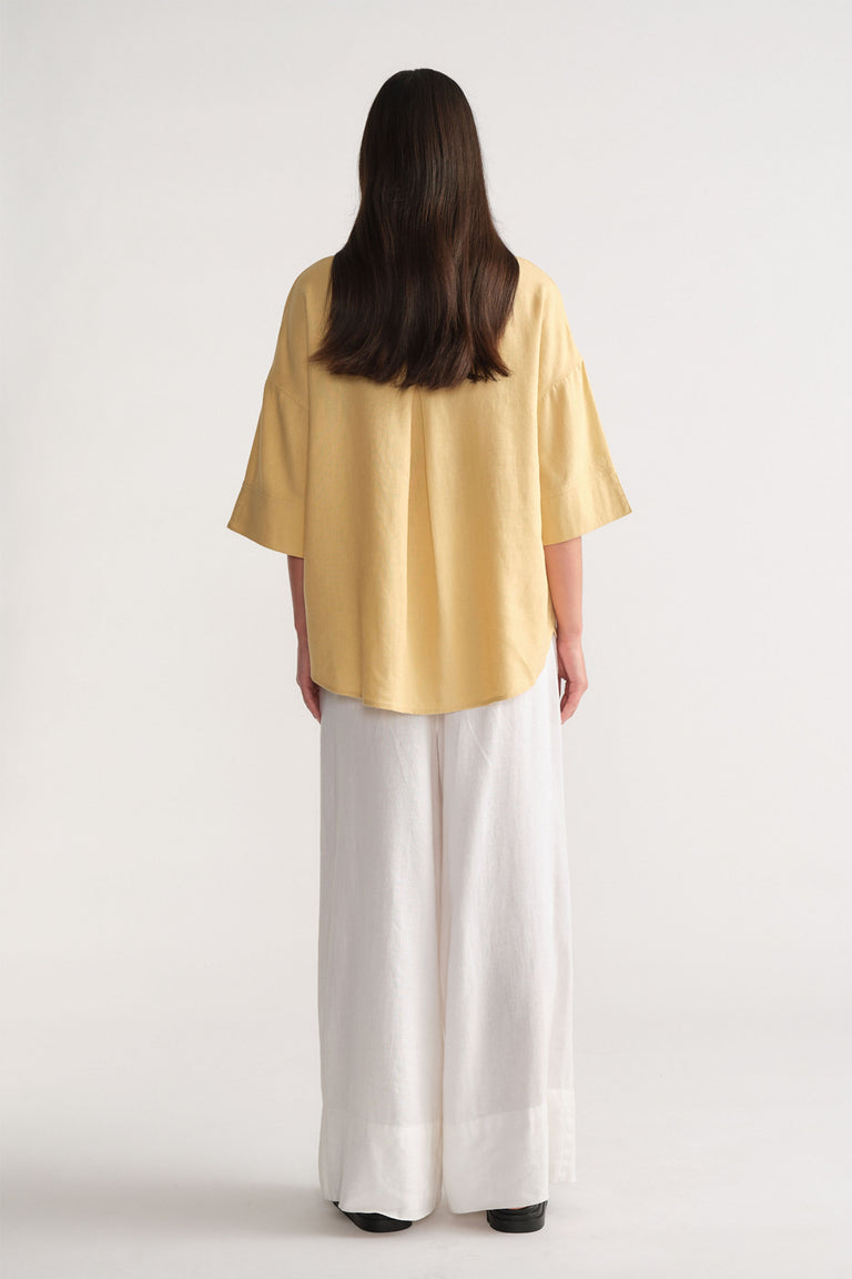 D-Luxe Linen Blend 3/4 Shirt in soft yellow, breathable fabric shown from the back in portrait gallery shot 3.
