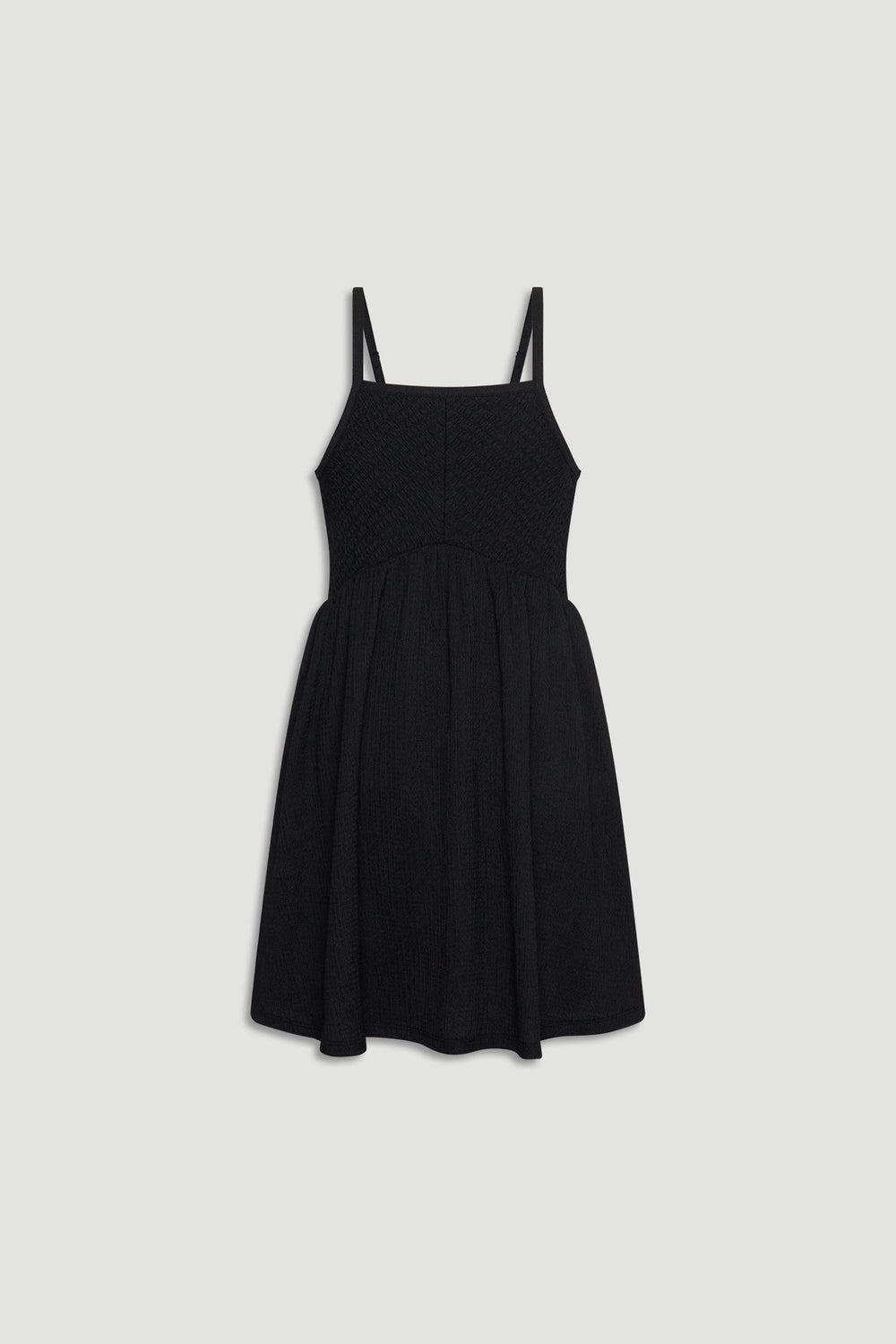 Black shirred girls dress with thin straps and a gathered skirt for an easy, stylish look.