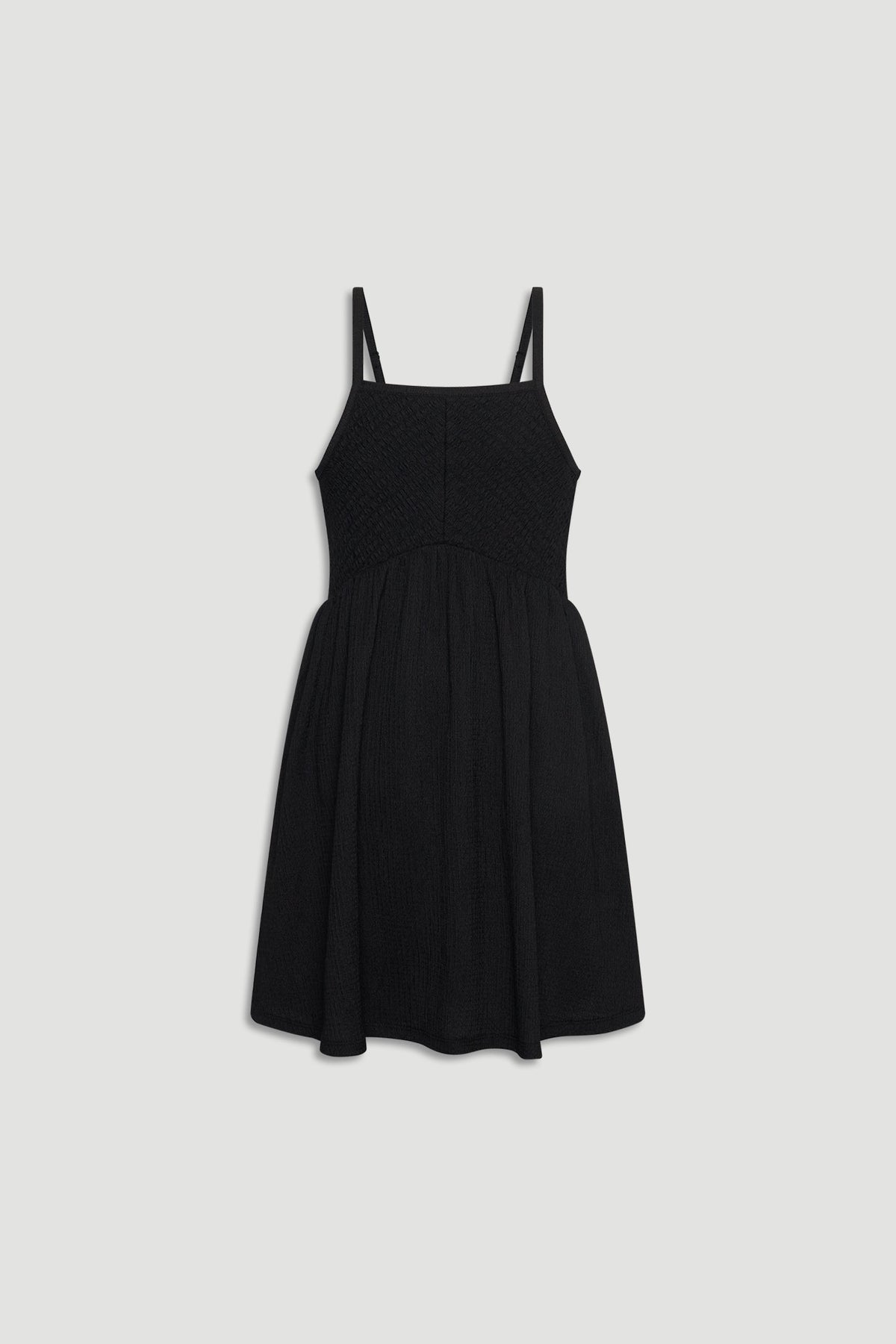 Black shirred girls dress with thin straps and a gathered skirt for an easy, stylish look.