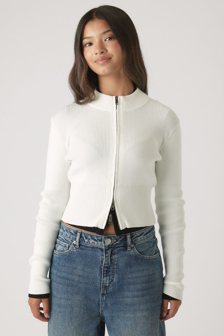 Girls Matilda Zip Up Knit in white ribbed knitwear with zip front, paired with casual mid-blue denim by DECJUBA Australian fashion brand