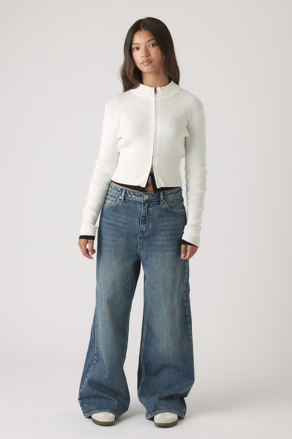 Girls Matilda Zip Up Knit in white ribbed knit with zip closure, paired with relaxed wide-leg blue denim by DECJUBA Australian brand