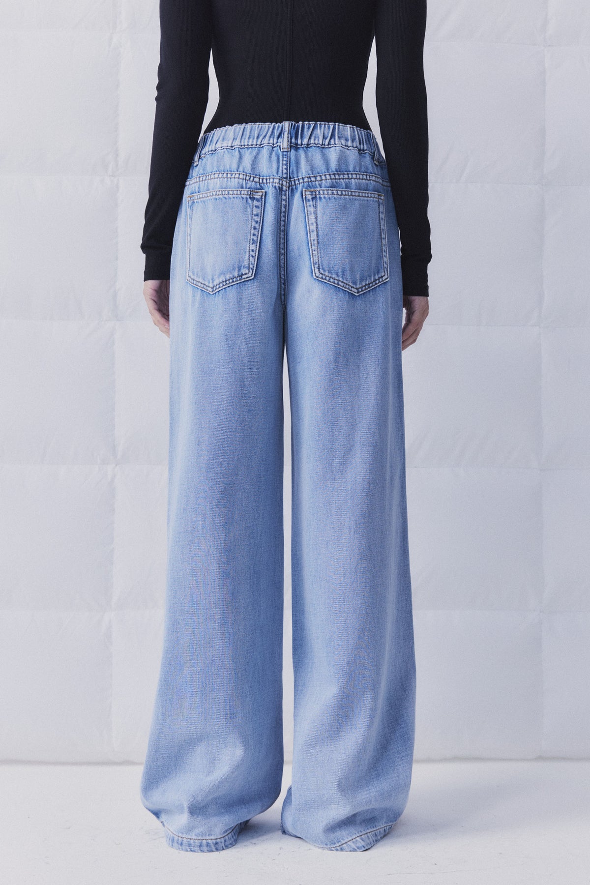D-Luxe Wide Leg Jean in light denim with elasticated high-rise waist shown from back, gallery position 4 portrait view