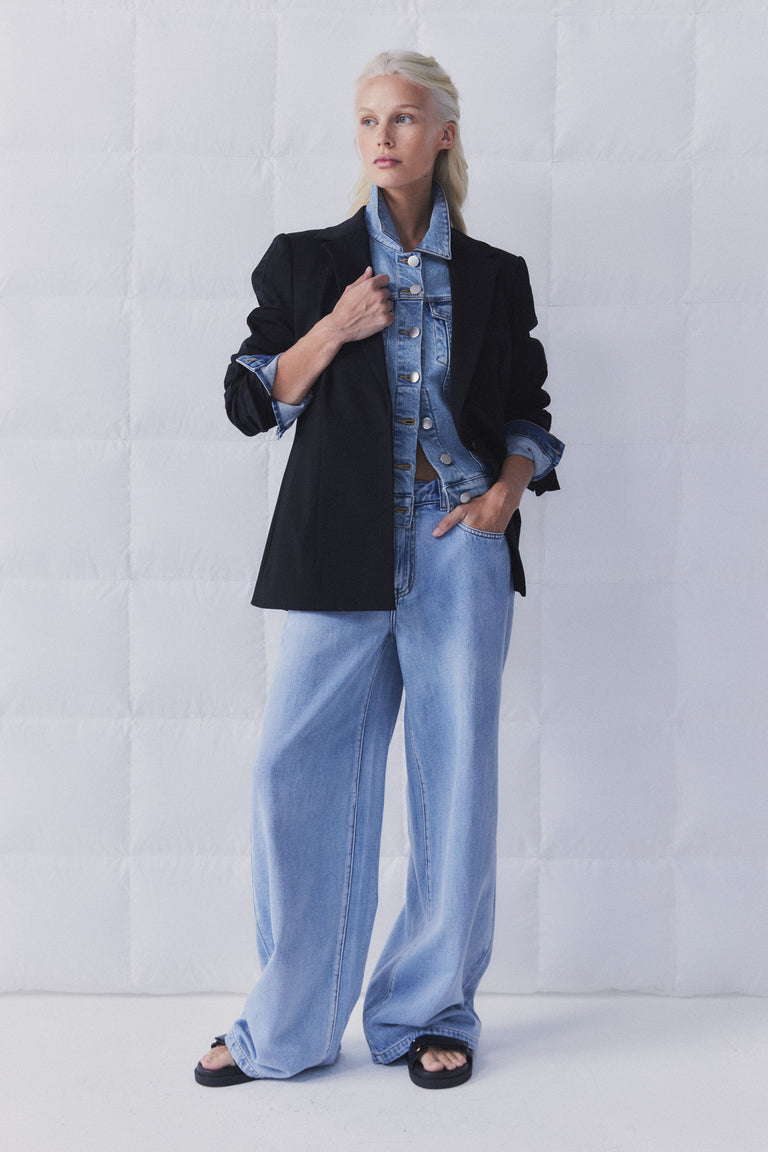 Portrait shot gallery 2 of model wearing D-Luxe Wide Leg Jean with black blazer and denim jacket layering