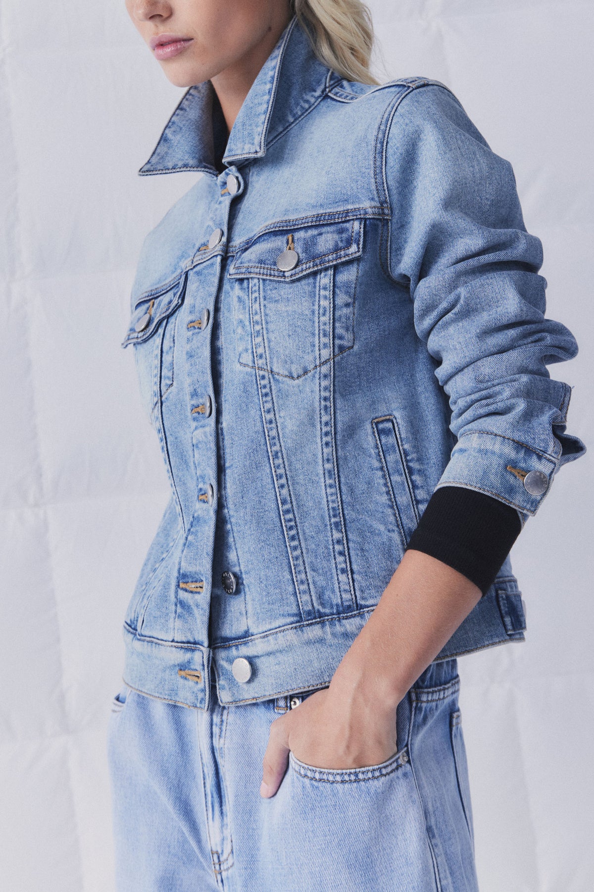 Portrait of model wearing D-Luxe Sienna Denim Jacket showing detailed button front and rolled sleeves, gallery position 2.