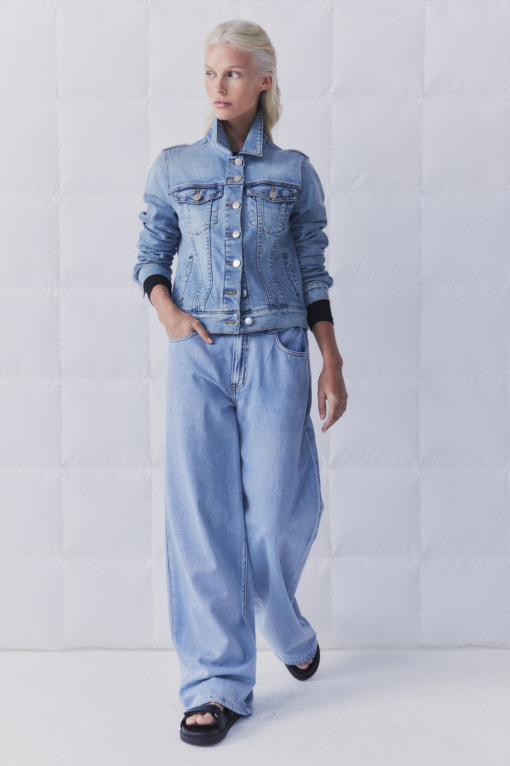 Model wearing D-Luxe Sienna Denim Jacket in portrait orientation, gallery position 1 with light wash denim style