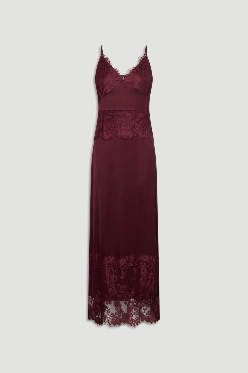 Plum lace maxi dress with delicate straps, featuring sheer lace panels at bust, waist, and hem for elegant texture.