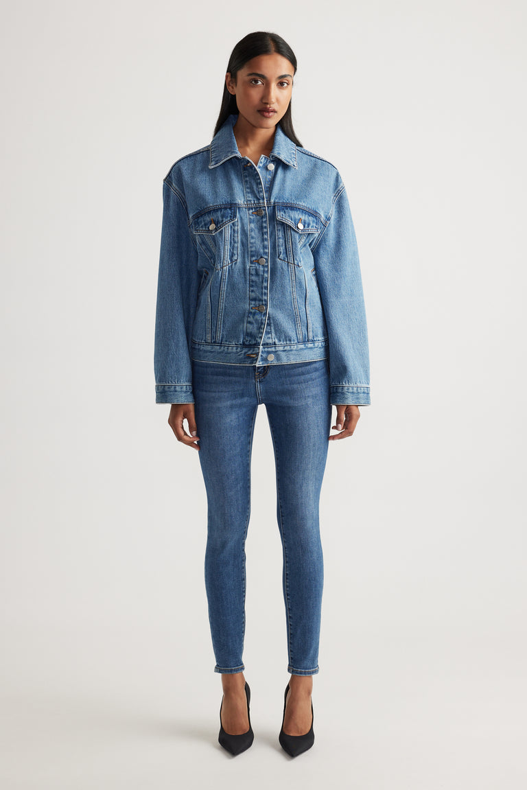 Model wearing Evie High Rise Skinny Jean in classic blue denim with matching denim jacket by Decjuba Australian fashion brand
