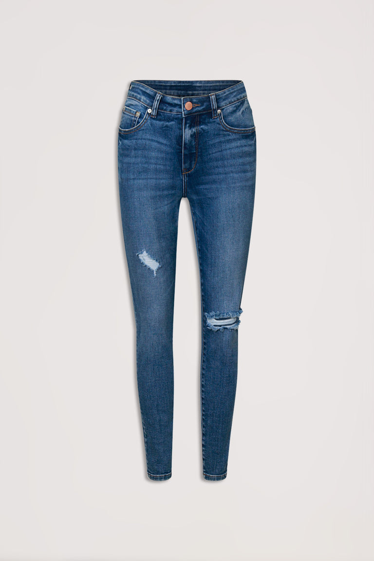 Mid-blue womens skinny jeans with subtle distressing and a high-rise waist, displayed against a neutral background