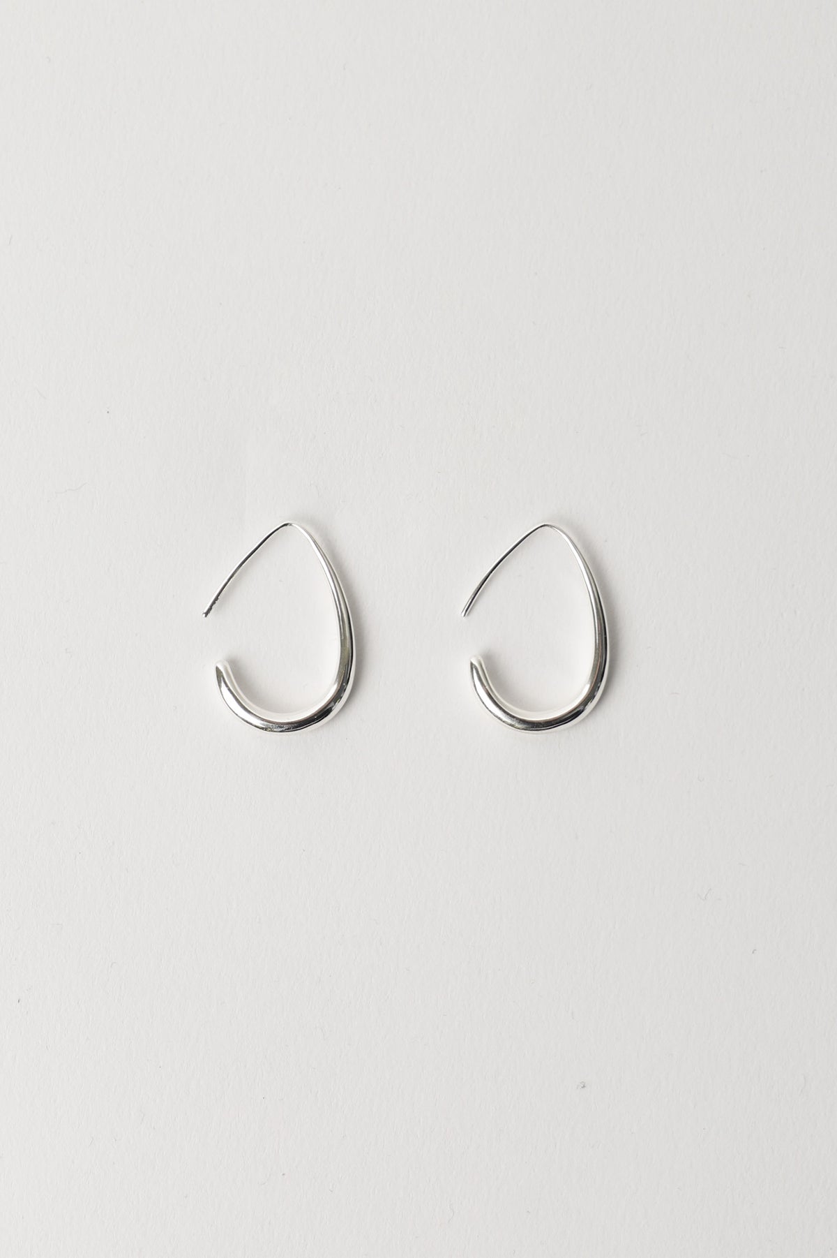 9ct Minimalist Hoop Earrings shown in gallery position 3 with irregular teardrop shape on white background
