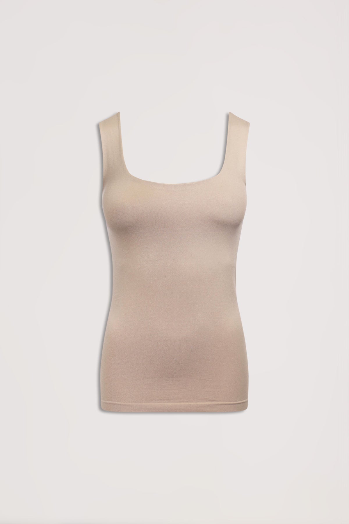 Beige seamless scoop neck tank top with wide straps and a fitted silhouette