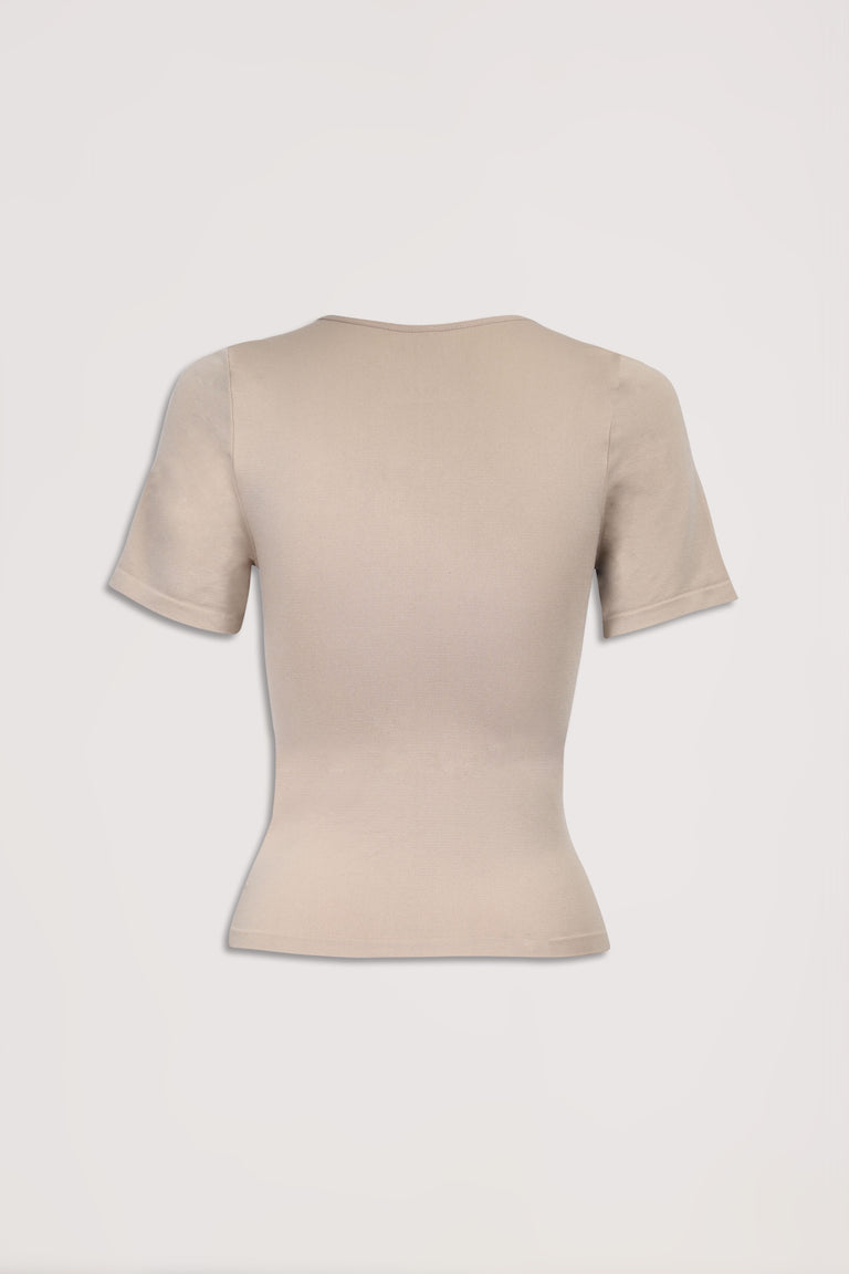 Beige fitted short sleeve crew neck tee on a plain background