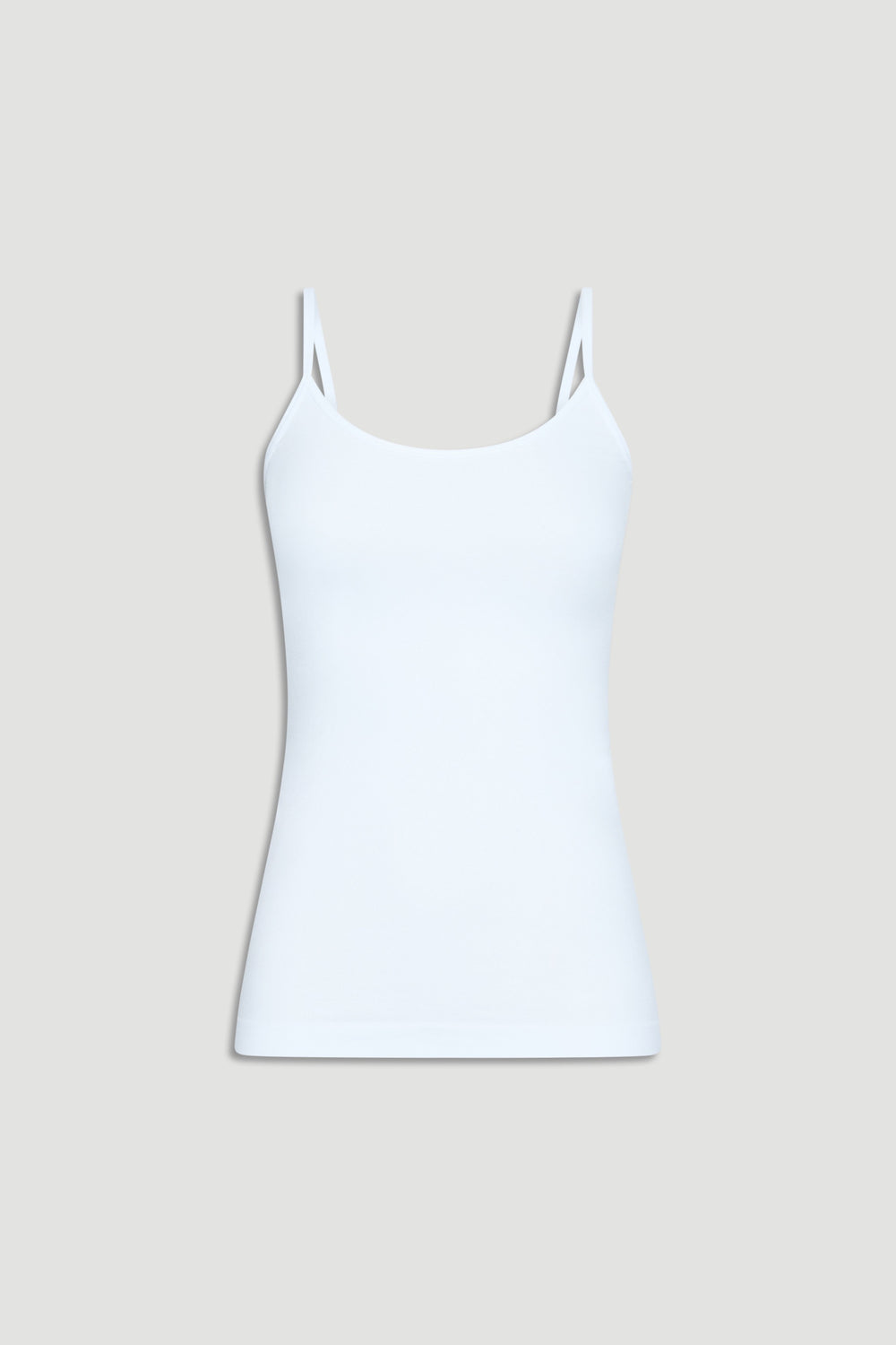 White seamless tank top with thin straps, offering a smooth, fitted silhouette for everyday comfort and style