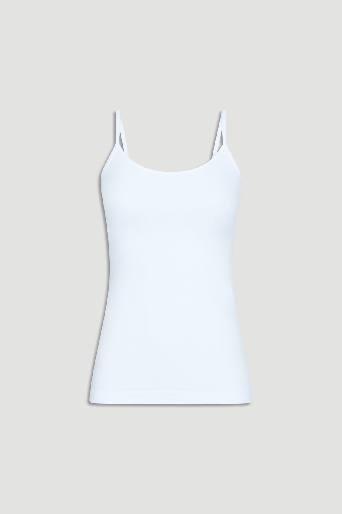 White seamless tank top with thin straps, offering a smooth, fitted silhouette for everyday comfort and style