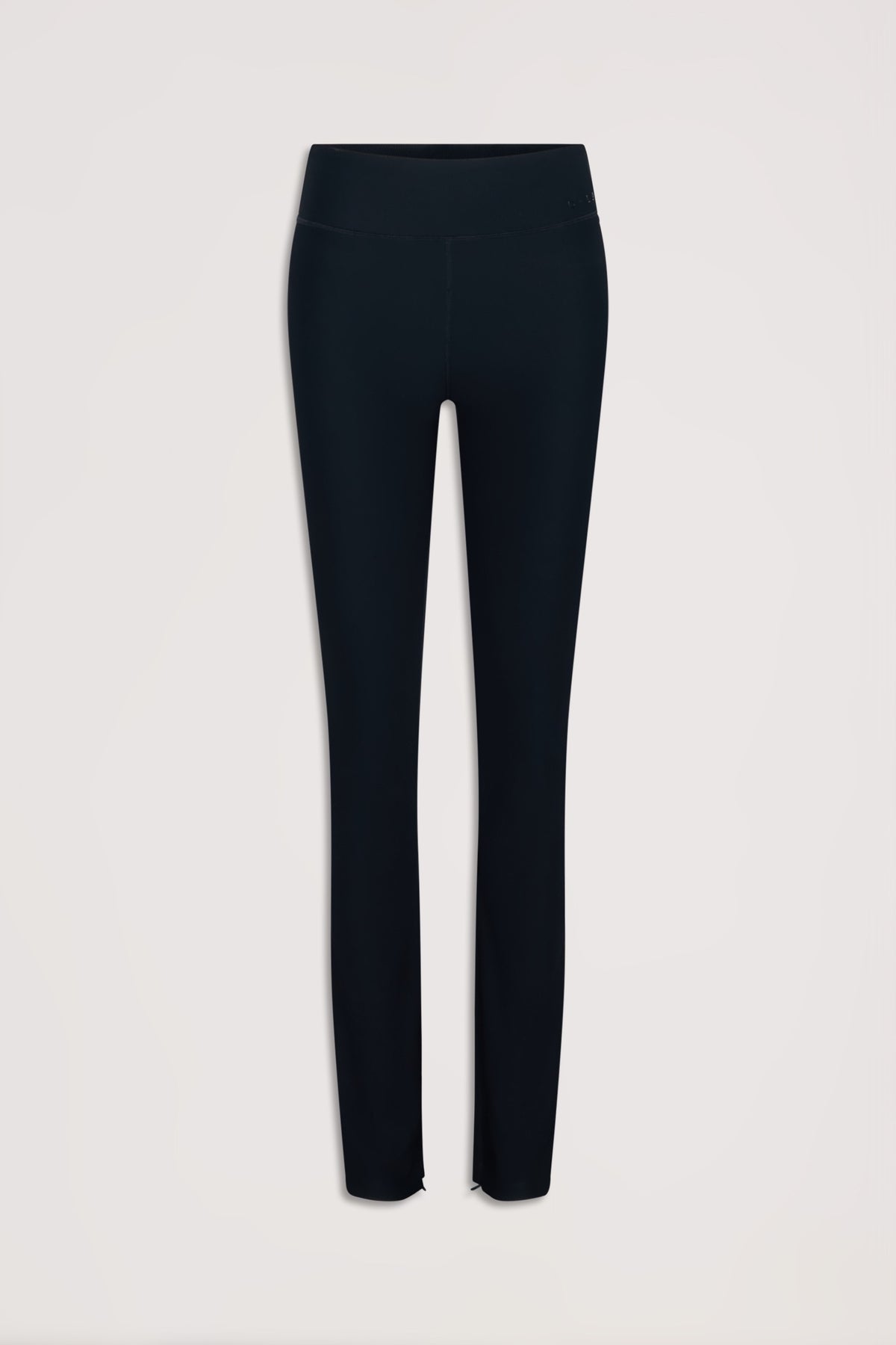 Black slim-fit ribbed leggings with a high waistband and subtle split hems for a sleek, versatile look