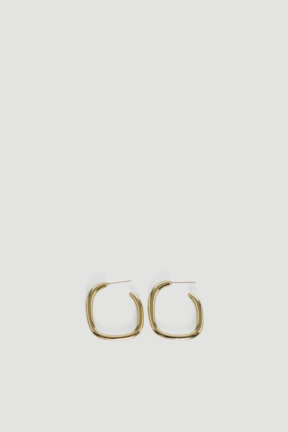 Gold-tone 9ct irregular shaped hoop earrings with a smooth polished finish for a chic, modern accessory.