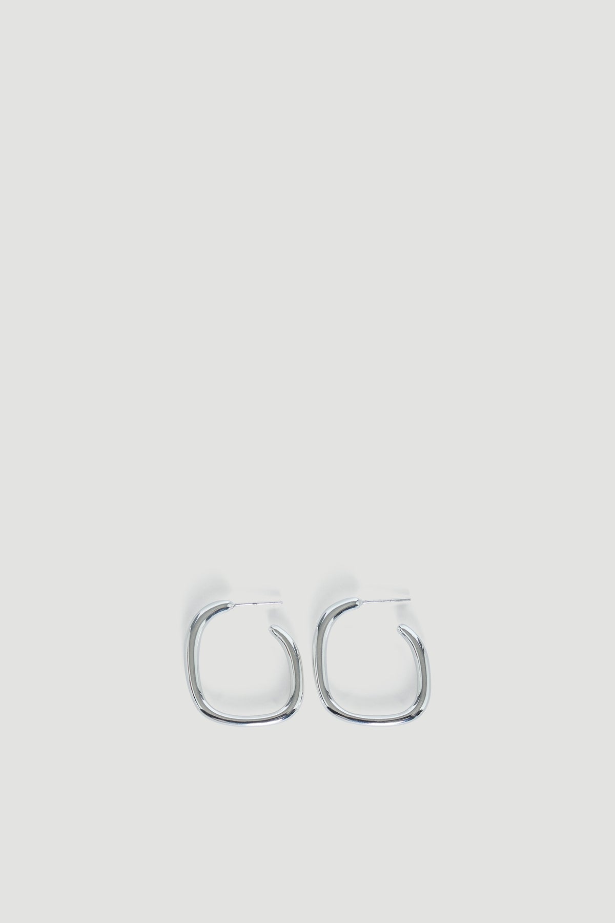 Pair of polished 9ct white gold irregular-shaped hoop earrings with a modern, minimalist design.