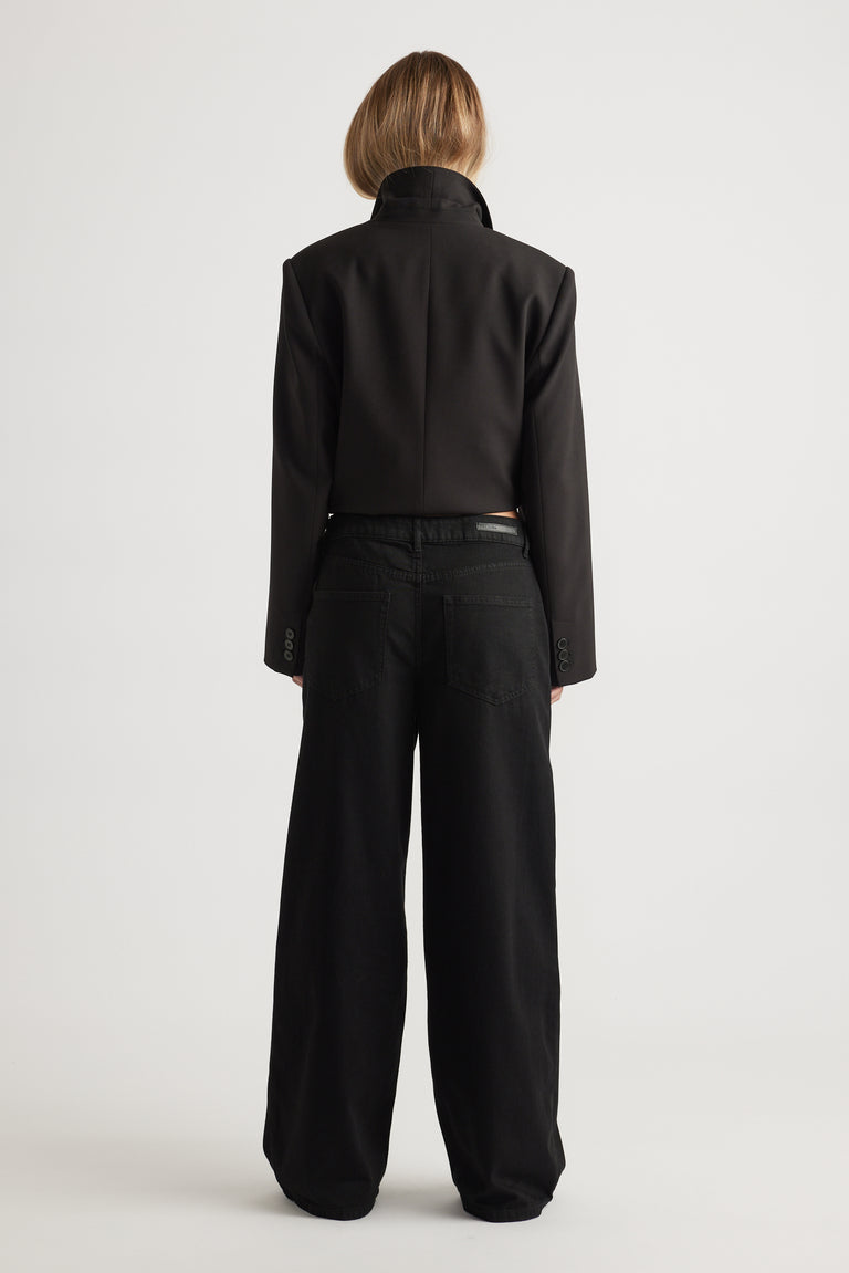 Rear view of wide leg Jenna Palazzo Jean in black cotton blend paired with tailored jacket by Decjuba Australian fashion brand