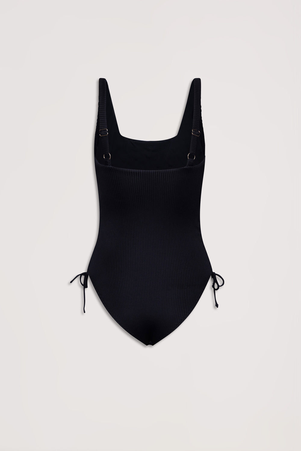 Black ribbed one-piece swimsuit with adjustable shoulder straps and side drawcord tie details on a plain background