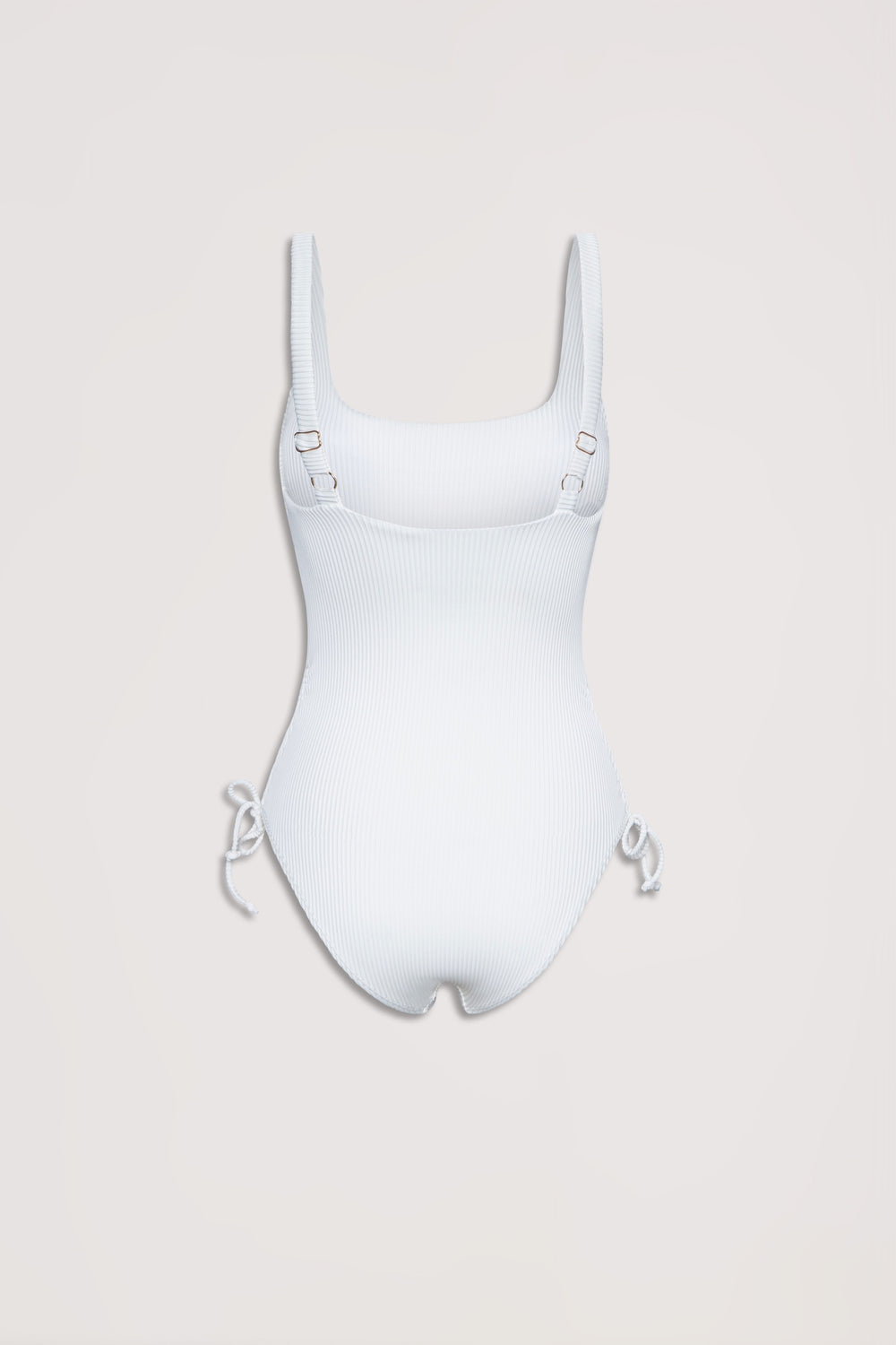 White ribbed one-piece swimsuit with adjustable shoulder straps and drawcord ties at the hips, laid flat on a neutral background