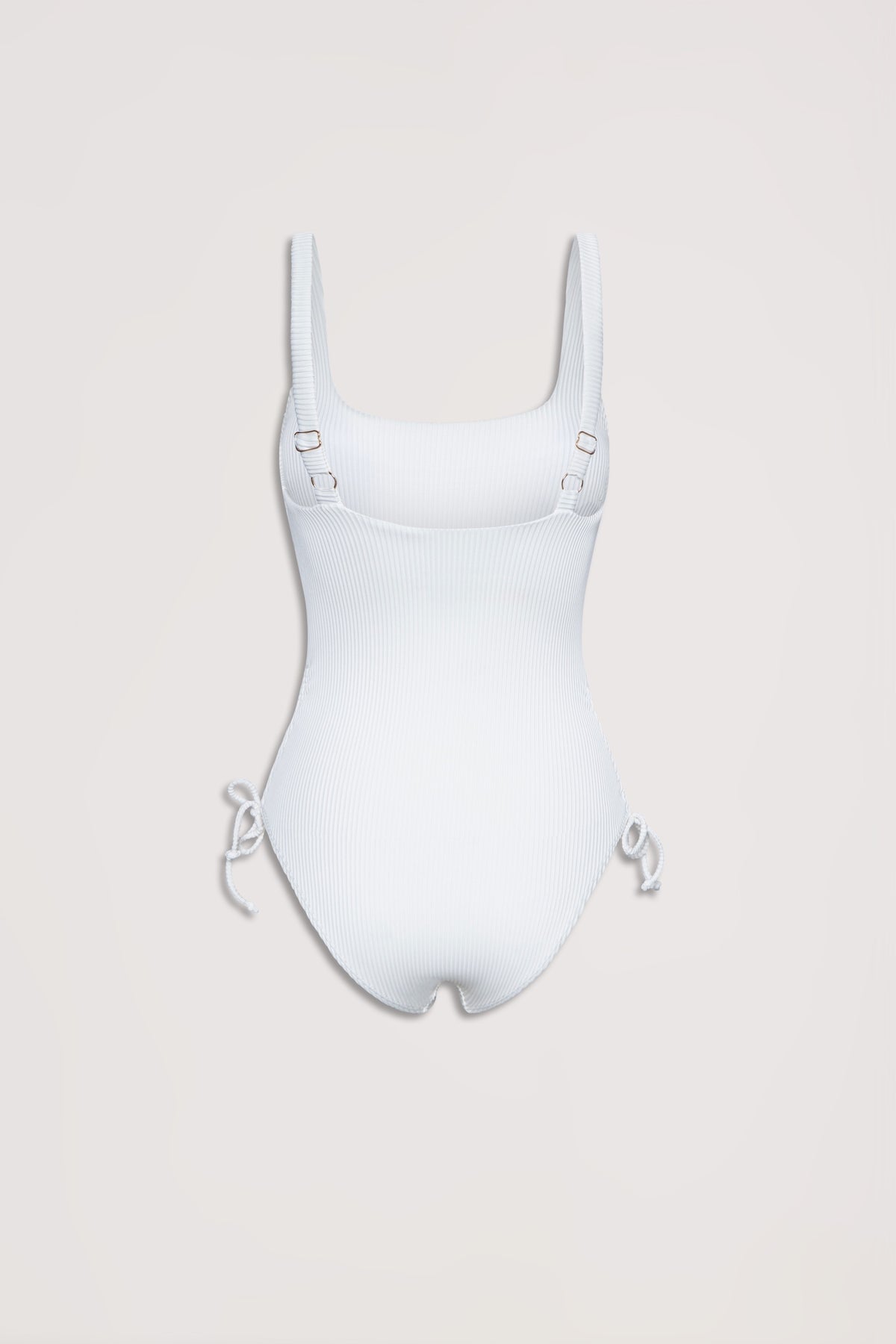 White ribbed one-piece swimsuit with adjustable shoulder straps and drawcord ties at the hips, laid flat on a neutral background