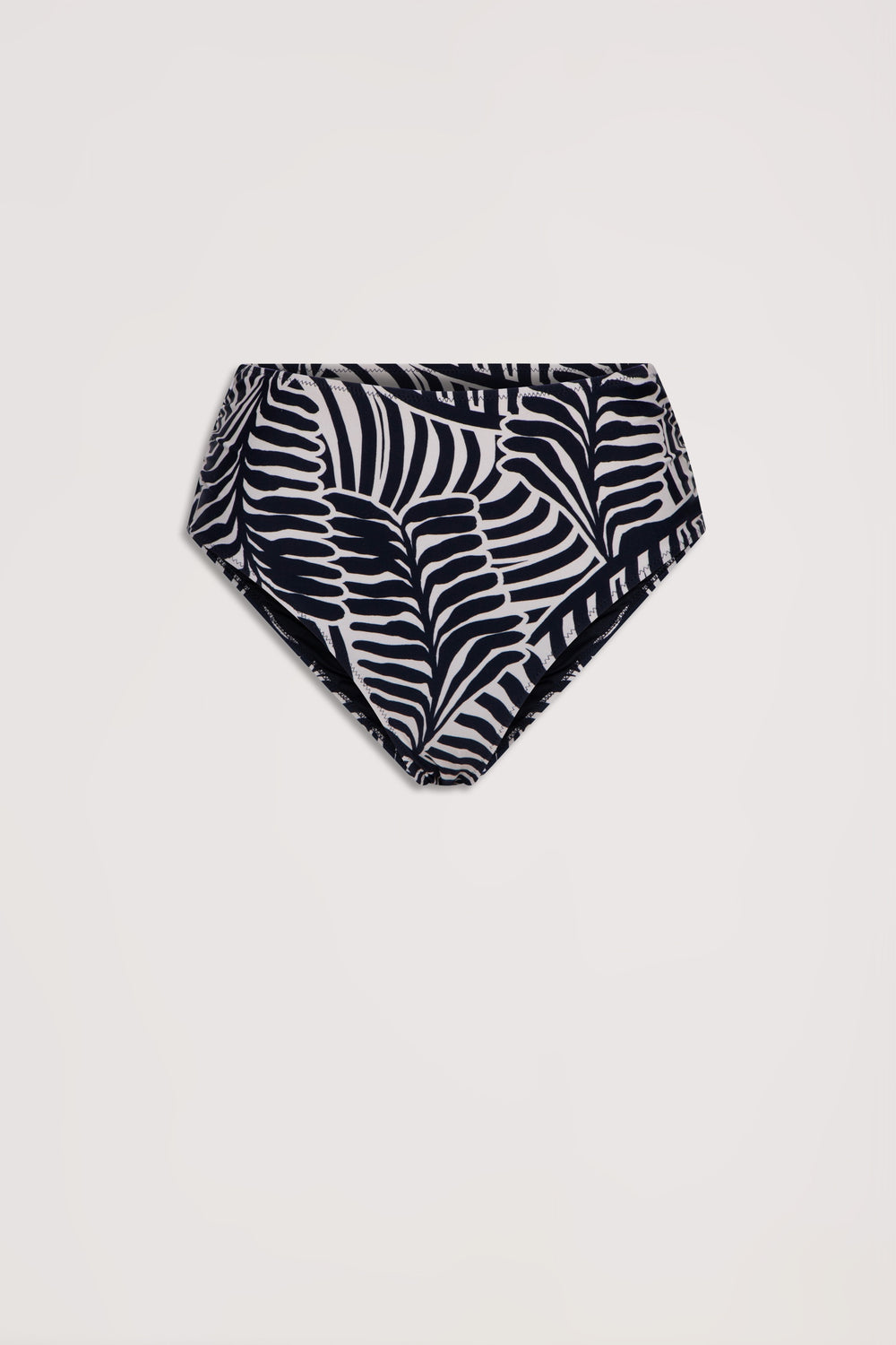 High-waisted bikini bottom with black and white tropical leaf print, laid flat against a light background