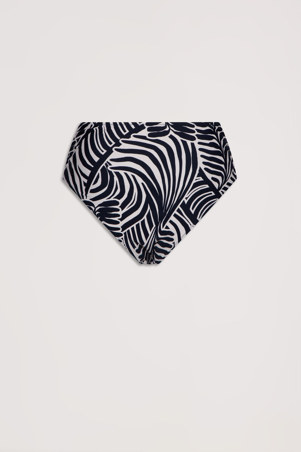 High-waisted bikini bottom in a bold black and white tropical leaf print with a matte finish.