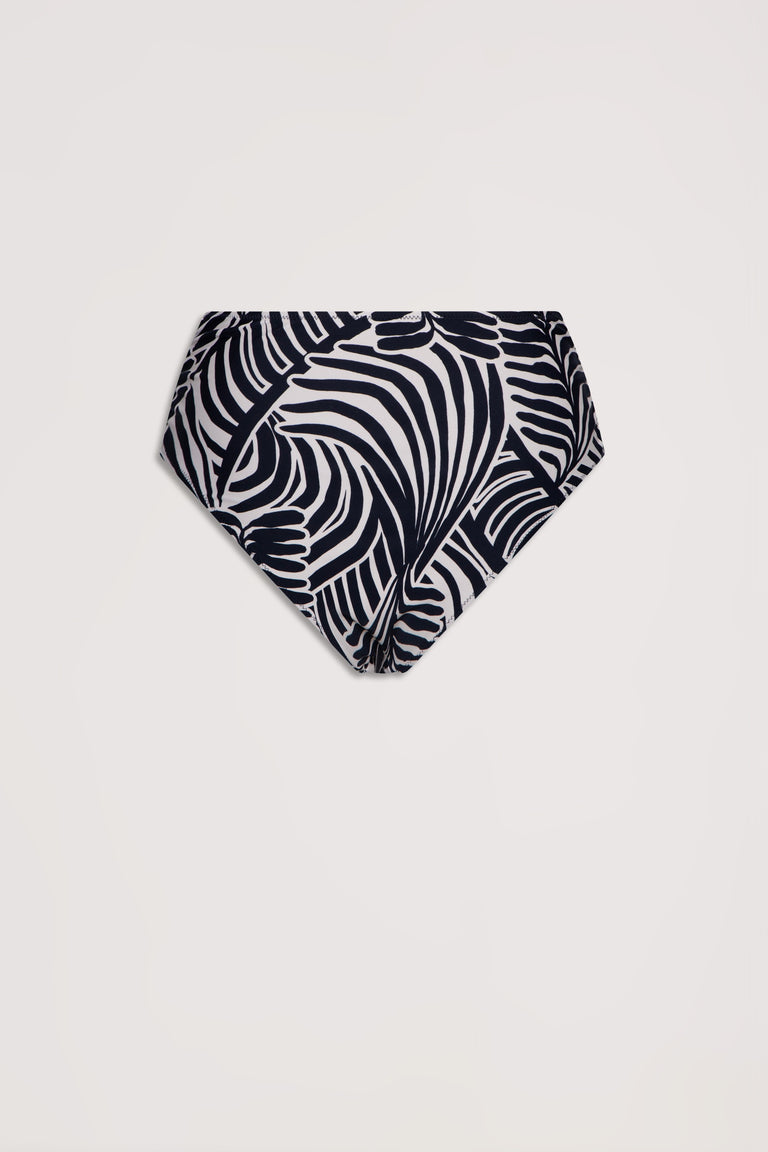 High-waisted bikini bottom in a bold black and white tropical leaf print with a matte finish.
