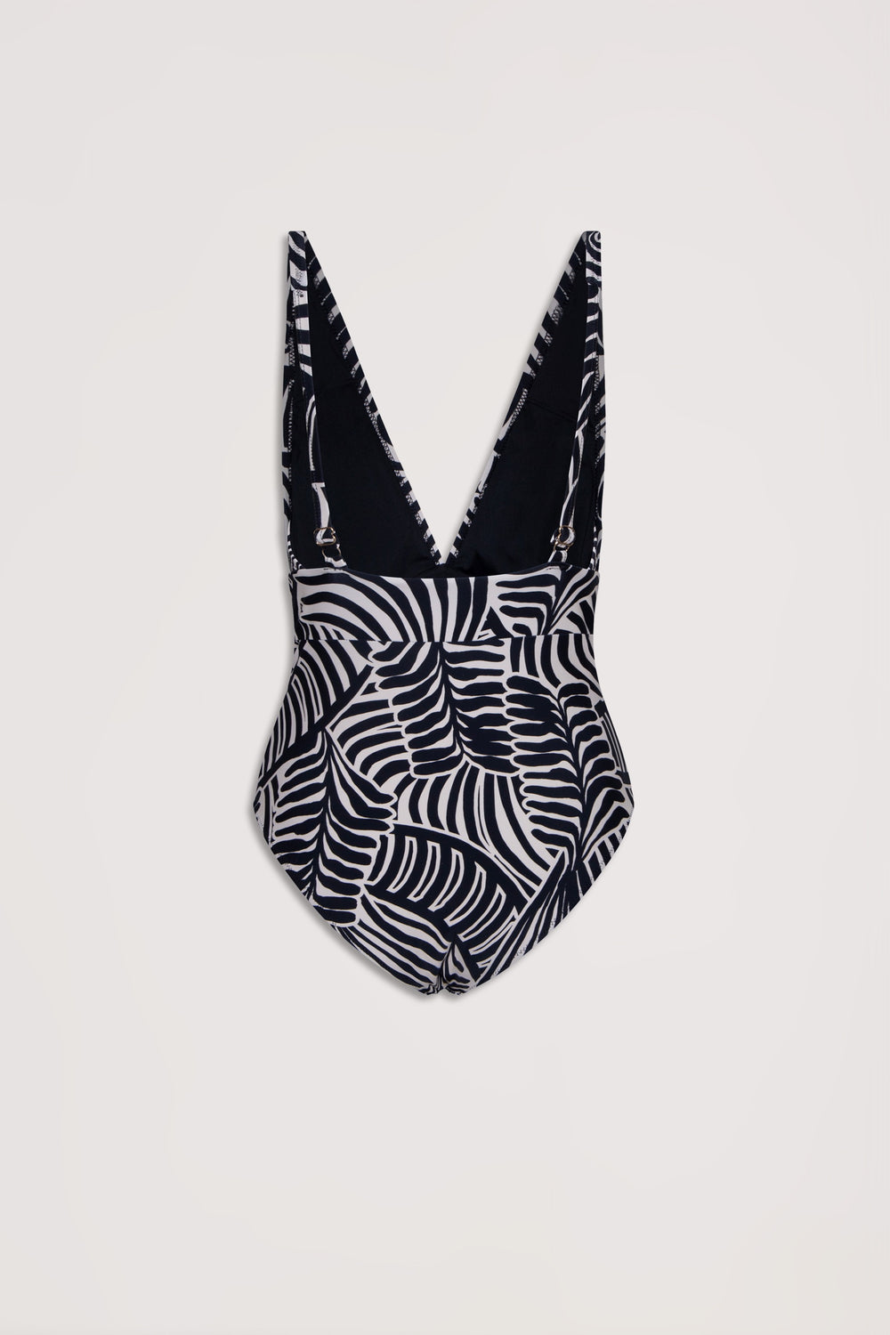 Black and white tropical leaf print one-piece swimsuit with a deep V back and adjustable shoulder straps